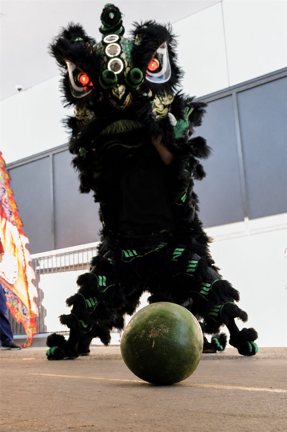 Chao Yi lion dance performer with a watermelon during a routine